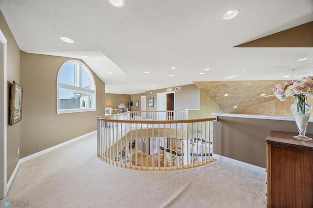 4126 Timberline Dr S, Fargo, ND 58104 - hallway featuring an upstairs landing, carpet, baseboards, lofted ceiling, and recessed lighting