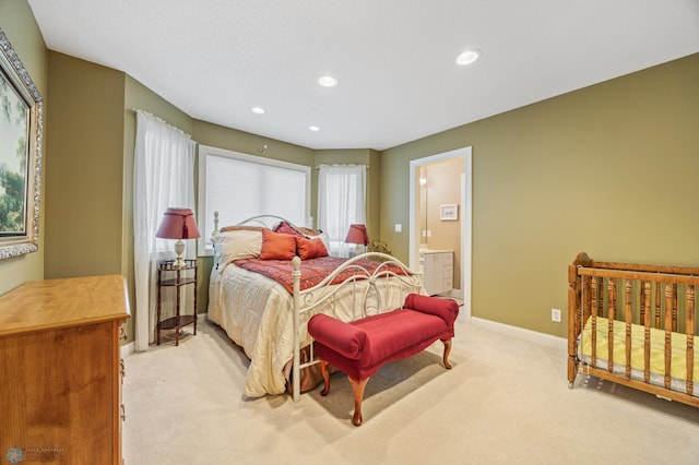 4126 Timberline Dr S, Fargo, ND 58104 - bedroom with light carpet, recessed lighting, baseboards, and ensuite bath