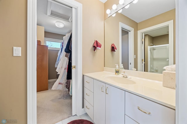 4126 Timberline Dr S, Fargo, ND 58104 - full bathroom with vanity, a stall shower, tile patterned floors, and baseboards