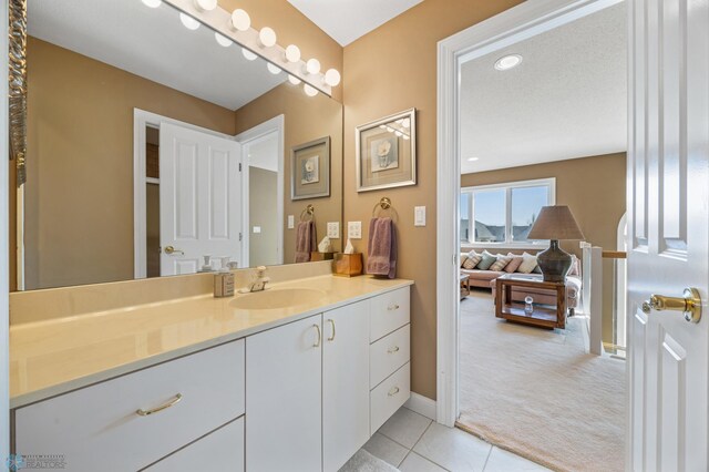4126 Timberline Dr S, Fargo, ND 58104 - bathroom featuring vanity, tile patterned flooring, and baseboards
