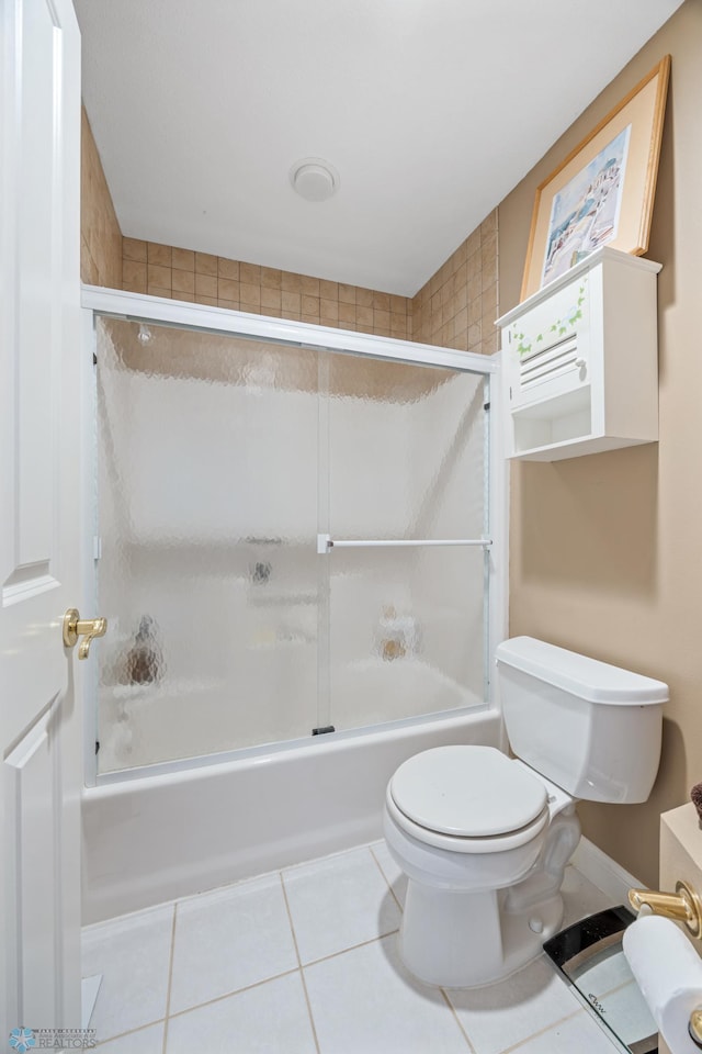 4126 Timberline Dr S, Fargo, ND 58104 - bathroom featuring shower / bath combination with glass door, toilet, and tile patterned floors
