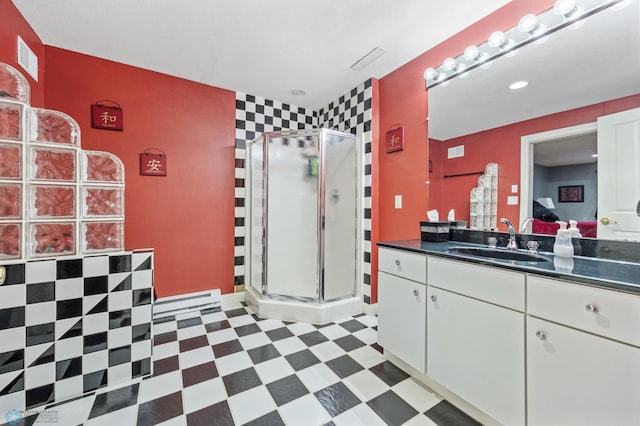 4126 Timberline Dr S, Fargo, ND 58104 - ensuite bathroom featuring a stall shower, vanity, tile patterned floors, and baseboard heating