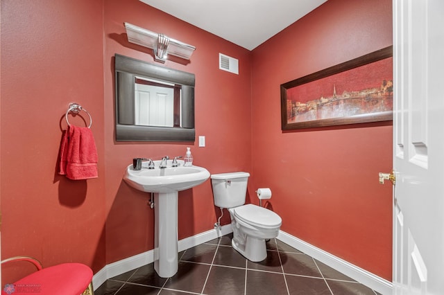 4126 Timberline Dr S, Fargo, ND 58104 - bathroom featuring toilet, tile patterned floors, and baseboards