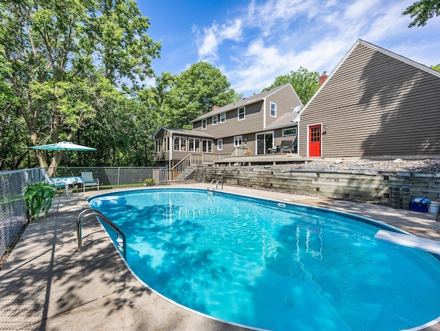 12576 Ridgewood Dr NW, Elk River, MN 55330 - view of swimming pool featuring a wooden deck and stairway