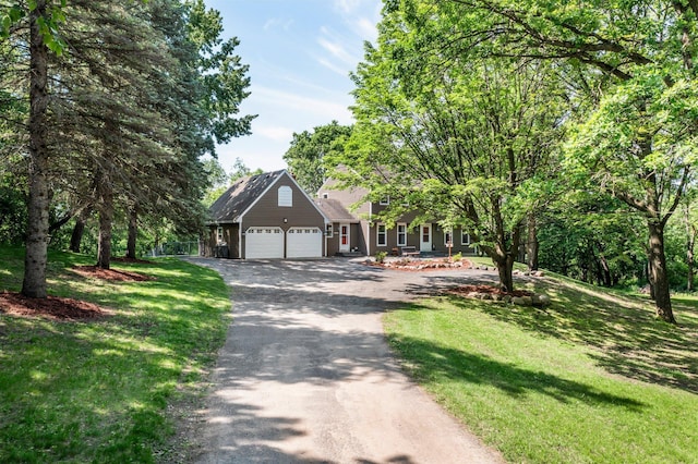 12576 Ridgewood Dr NW, Elk River, MN 55330 - view of front of house featuring driveway, a garage, and a front lawn