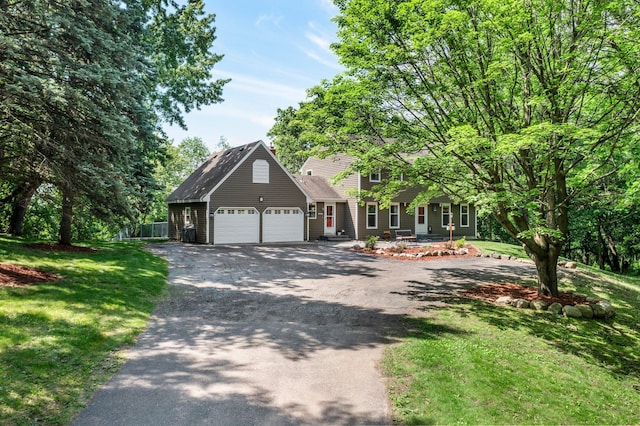 12576 Ridgewood Dr NW, Elk River, MN 55330 - view of front facade featuring an attached garage and driveway