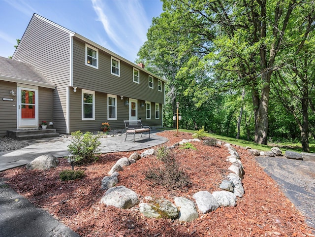12576 Ridgewood Dr NW, Elk River, MN 55330 - back of property with a patio area
