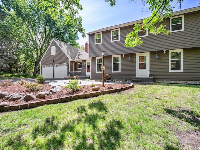 12576 Ridgewood Dr NW, Elk River, MN 55330 - colonial inspired home with a front yard, concrete driveway, and a garage