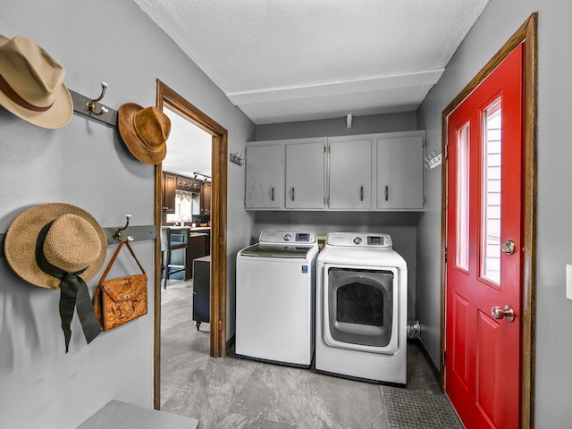 12576 Ridgewood Dr NW, Elk River, MN 55330 - laundry room with cabinet space, independent washer and dryer, and a textured ceiling