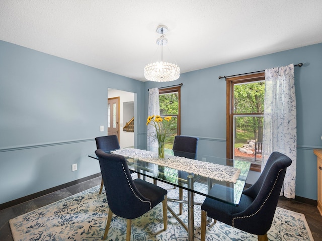12576 Ridgewood Dr NW, Elk River, MN 55330 - dining space with a chandelier, healthy amount of natural light, stairway, and baseboards