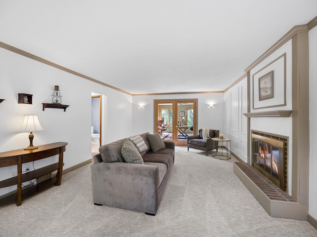 12576 Ridgewood Dr NW, Elk River, MN 55330 - living room with carpet floors, crown molding, a glass covered fireplace, french doors, and baseboards