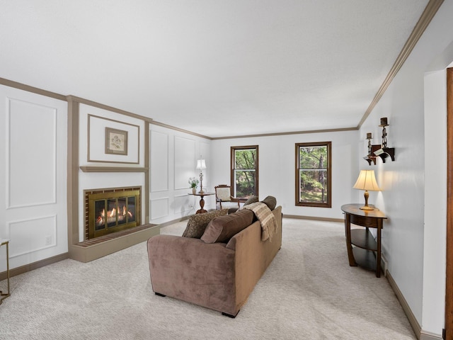12576 Ridgewood Dr NW, Elk River, MN 55330 - living area featuring crown molding, light carpet, baseboards, and a glass covered fireplace