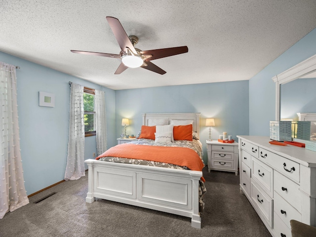 12576 Ridgewood Dr NW, Elk River, MN 55330 - bedroom featuring a textured ceiling, dark colored carpet, and ceiling fan