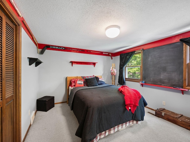 12576 Ridgewood Dr NW, Elk River, MN 55330 - bedroom featuring carpet, a textured ceiling, and baseboards