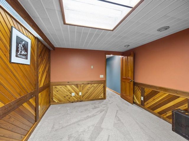 12576 Ridgewood Dr NW, Elk River, MN 55330 - empty room featuring wooden walls and carpet flooring