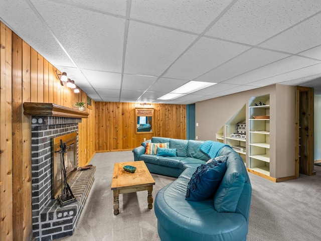 12576 Ridgewood Dr NW, Elk River, MN 55330 - living area with wood walls, light carpet, a brick fireplace, a drop ceiling, and baseboards