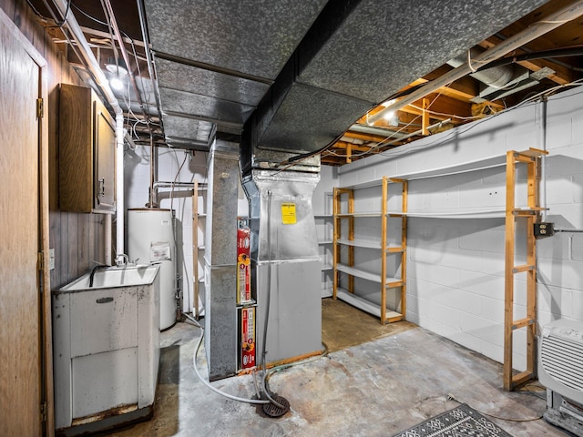 12576 Ridgewood Dr NW, Elk River, MN 55330 - unfinished below grade area with water heater, heating unit, and concrete block wall