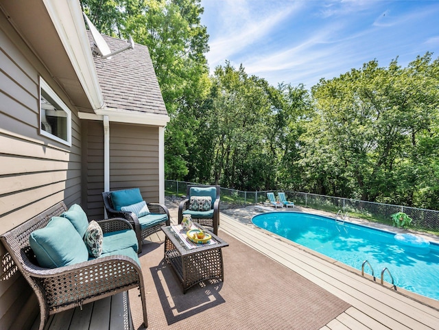 12576 Ridgewood Dr NW, Elk River, MN 55330 - view of pool featuring outdoor lounge area and view of wooded area