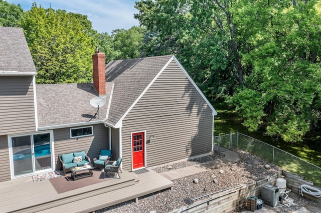 12576 Ridgewood Dr NW, Elk River, MN 55330 - back of house featuring outdoor lounge area, a wooden deck, and a chimney