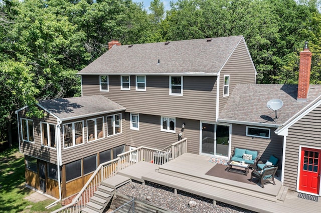 12576 Ridgewood Dr NW, Elk River, MN 55330 - back of house featuring outdoor lounge area, a chimney, a deck, and a shingled roof