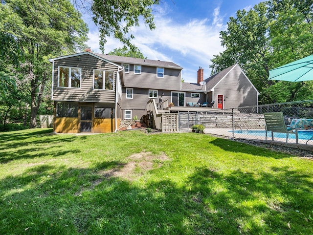 12576 Ridgewood Dr NW, Elk River, MN 55330 - back of house with stairway, a sunroom, and a deck