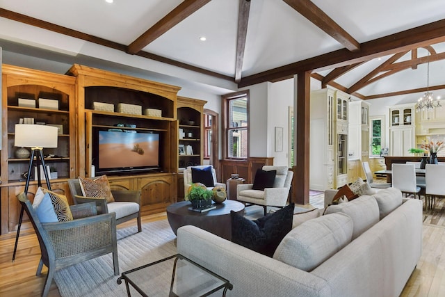 1721 Mount Curve Ave, Minneapolis, MN 55403 - living room with beamed ceiling, light wood-style floors, a chandelier, a decorative wall, and wainscoting