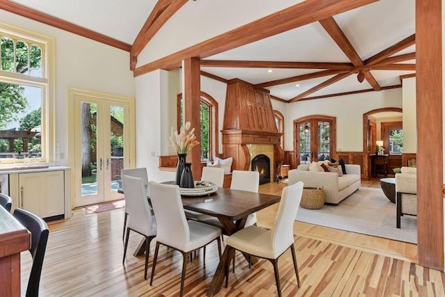1721 Mount Curve Ave, Minneapolis, MN 55403 - dining room with french doors, light wood-type flooring, a wainscoted wall, healthy amount of natural light, and recessed lighting
