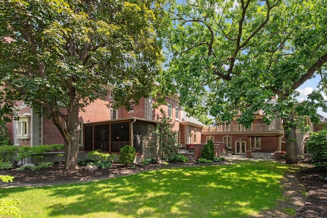 1721 Mount Curve Ave, Minneapolis, MN 55403 - view of grassy yard featuring french doors, a sunroom, and a balcony