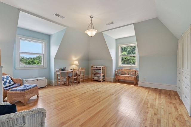 1721 Mount Curve Ave, Minneapolis, MN 55403 - living area featuring light wood-style floors, vaulted ceiling, and baseboards