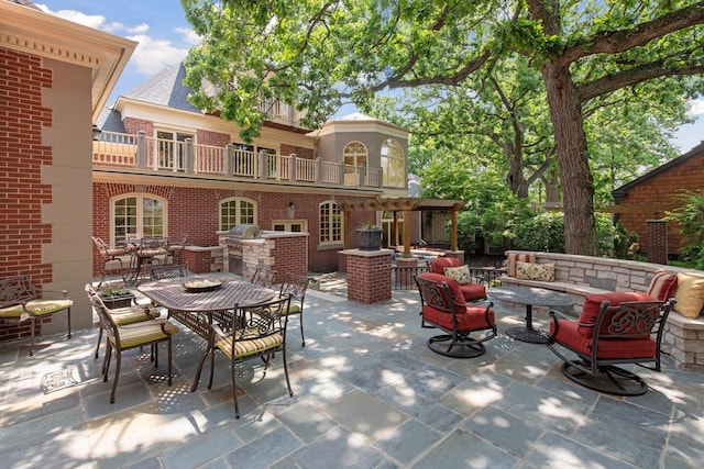 1721 Mount Curve Ave, Minneapolis, MN 55403 - view of patio featuring a balcony, area for grilling, an outdoor living space with a fire pit, and outdoor dining space