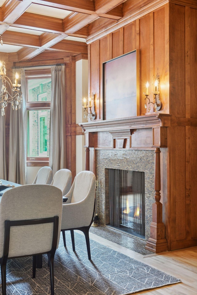 1721 Mount Curve Ave, Minneapolis, MN 55403 - living room with coffered ceiling, wooden walls, beam ceiling, a premium fireplace, and a chandelier