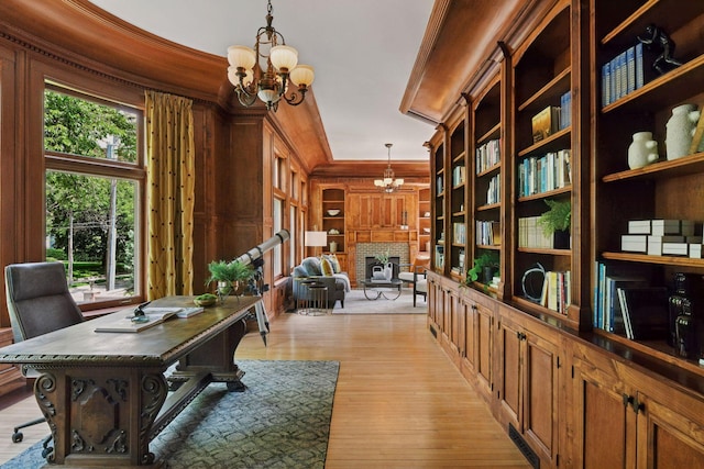 1721 Mount Curve Ave, Minneapolis, MN 55403 - office area with a chandelier, a brick fireplace, and light wood finished floors