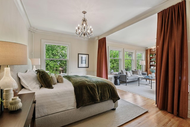 1721 Mount Curve Ave, Minneapolis, MN 55403 - bedroom with a chandelier, crown molding, light wood-style flooring, and wainscoting