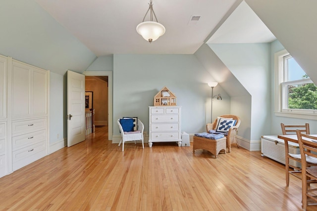 1721 Mount Curve Ave, Minneapolis, MN 55403 - living area with light wood-type flooring, lofted ceiling, and baseboards