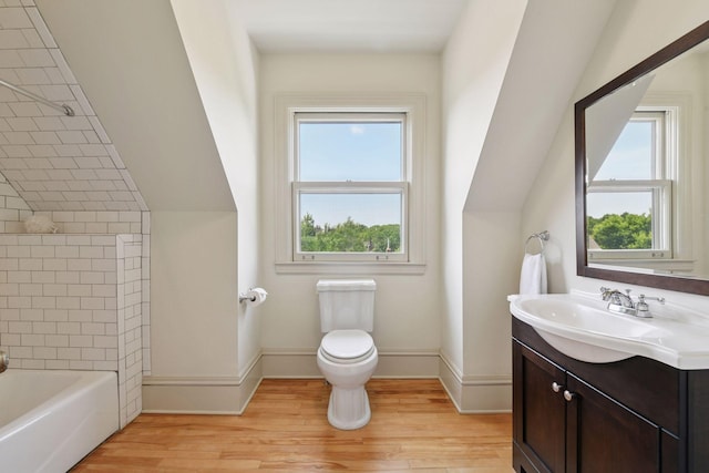 1721 Mount Curve Ave, Minneapolis, MN 55403 - full bath with vanity, toilet, wood finished floors, bathtub / shower combination, and baseboards