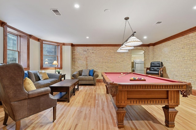 1721 Mount Curve Ave, Minneapolis, MN 55403 - playroom with brick wall, light wood-style flooring, ornamental molding, pool table, and recessed lighting
