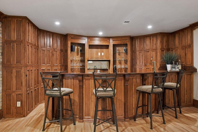 1721 Mount Curve Ave, Minneapolis, MN 55403 - indoor wet bar with light wood-style floors and recessed lighting