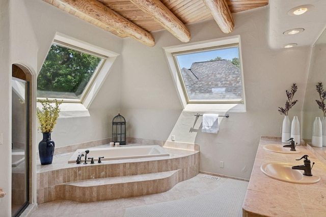 1721 Mount Curve Ave, Minneapolis, MN 55403 - bathroom with healthy amount of natural light, a bath, double vanity, wood ceiling with exposed beams, and tile patterned flooring