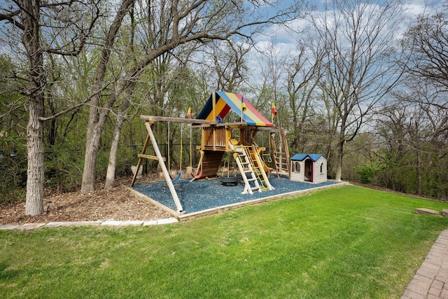 view of jungle gym with a lawn, an outbuilding, and a storage unit