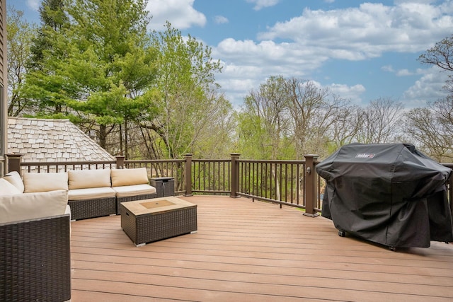wooden deck featuring outdoor lounge area and area for grilling