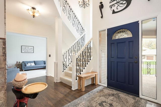 entrance foyer with wood finished floors and stairs