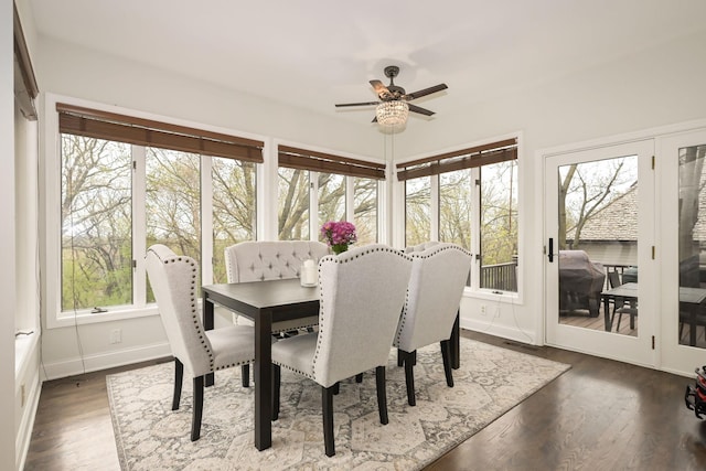 sunroom featuring wood finished floors and baseboards