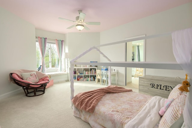 bedroom featuring baseboards, ceiling fan, and carpet flooring