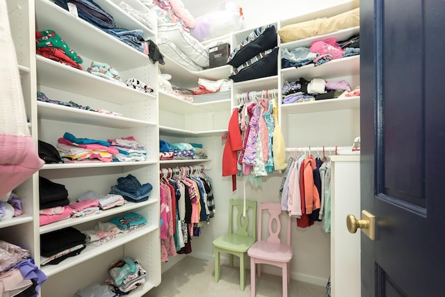 spacious closet with carpet floors