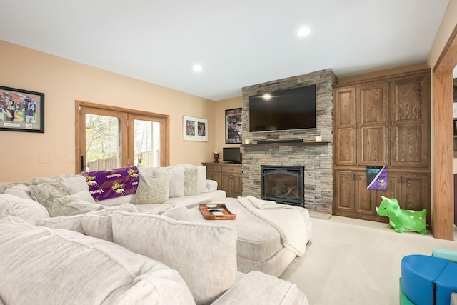 carpeted living room featuring a fireplace and recessed lighting