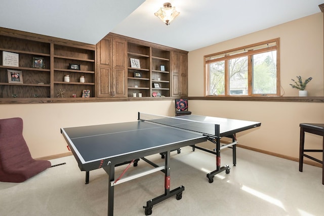 game room featuring light carpet and baseboards