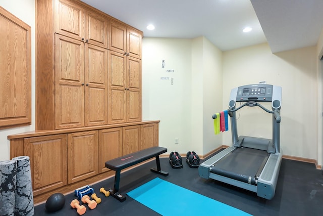 exercise room featuring baseboards and recessed lighting