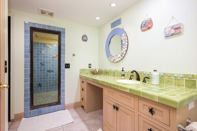bathroom featuring tile patterned flooring, a shower stall, vanity, and recessed lighting