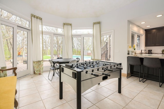 playroom featuring light tile patterned flooring and recessed lighting