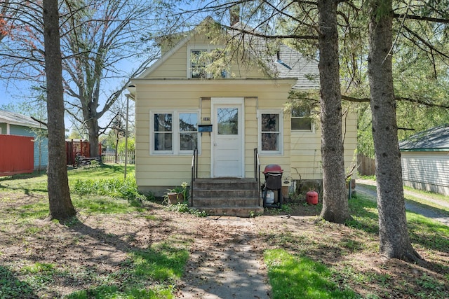 305 Pierson Ave, New Richmond, WI 54017 - view of front facade featuring entry steps and fence